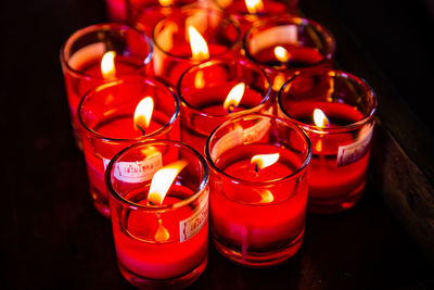 High angle view of candles on table in darkroom