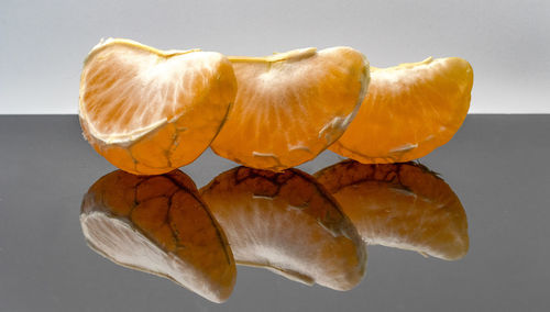 Close-up of lemon slice on table