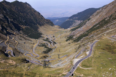 High angle view of winding roads against mountains