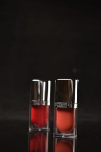 Close-up of wine glass against black background