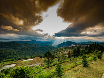 Scenic view of landscape against cloudy sky