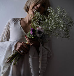 Young woman holding bouquet