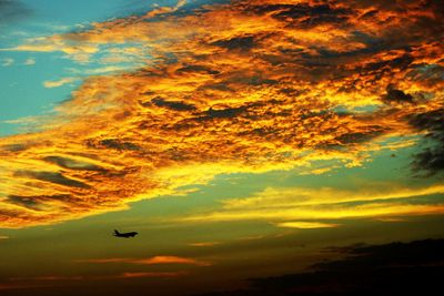 Low angle view of cloudy sky at sunset