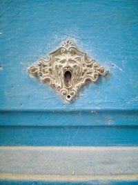 Close-up of door knocker on building wall