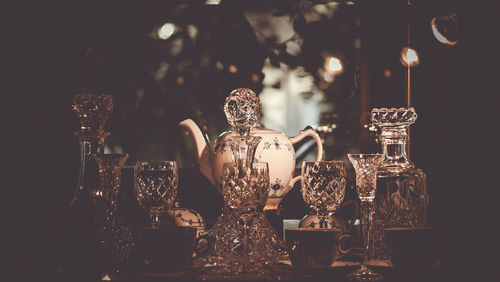 Close-up of illuminated glass on table