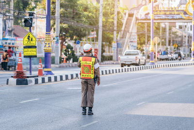 Rear view of man on city street