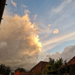 Low angle view of buildings against sky during sunset