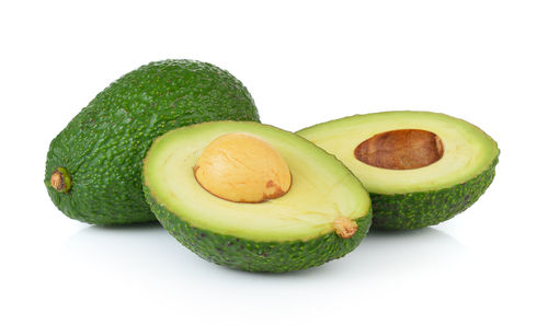 Close-up of fruits against white background