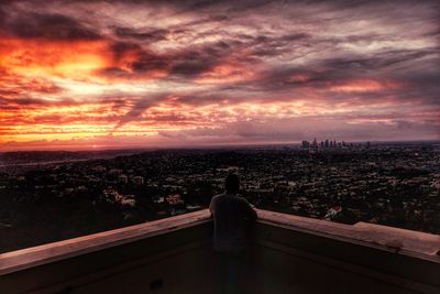 Dramatic sky over city at sunset