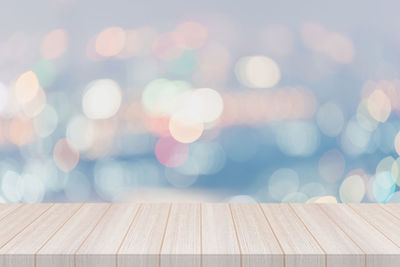 Defocused image of illuminated lights on table