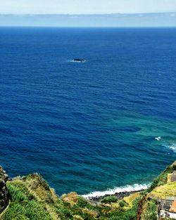 High angle view of sea against blue sky