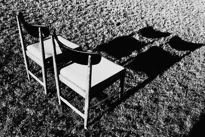 High angle view of chairs on beach