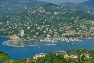 High angle view of townscape by sea