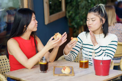 Smiling friends having drink