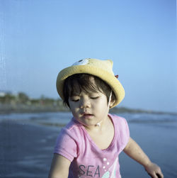 Close-up of child on beach