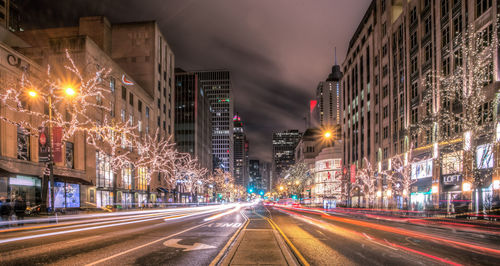 Illuminated city street at night