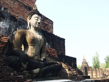 Statue of historic building against sky