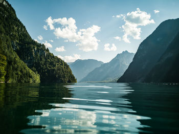 Scenic view of lake and mountains against sky