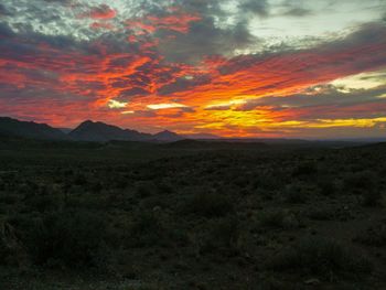 Scenic view of landscape against sky during sunset