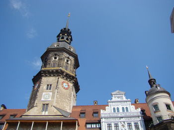 Low angle view of building against blue sky