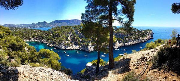 Scenic view of river against blue sky