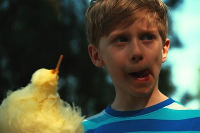 Close-up of boy holding cotton candy