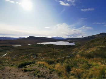 Scenic view of landscape and mountains against sky