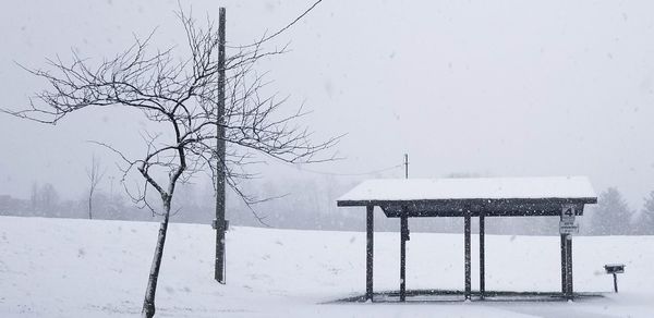 Snow covered landscape against sky