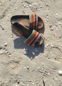 High angle view of shoes on sand