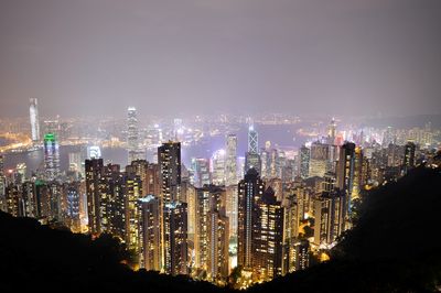 Aerial view of city lit up at night