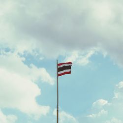Low angle view of flag against sky