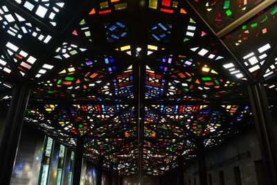 Low angle view of illuminated chandelier in building