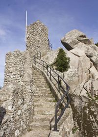 Sintra castle of the moors stone stairway, in a sunny day