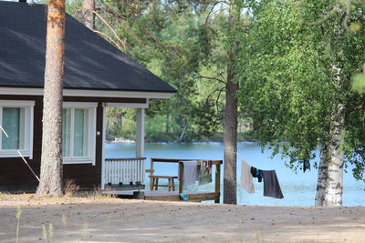 House and trees by building