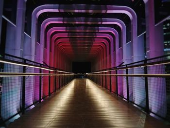 Empty illuminated corridor of building