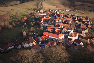 High angle view of houses and agricultural field