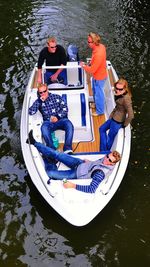 Directly above shot of people in motorboat on lake