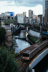 High angle view of canal amidst buildings in city