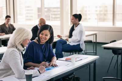 Adults working together in class