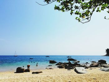 Scenic view of beach against clear sky