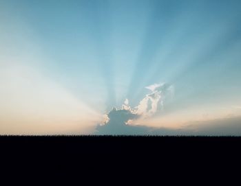 Silhouette landscape against sky