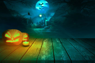 Close-up of illuminated pumpkin on table