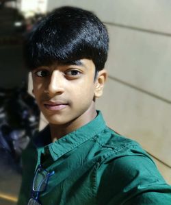 Portrait of smiling boy standing outdoors