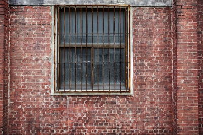 Full frame shot of window on brick wall of building