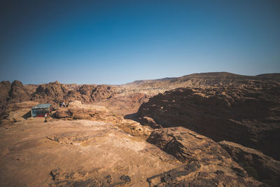 Scenic view of mountains against clear blue sky