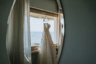 Wedding dress reflected in mirror