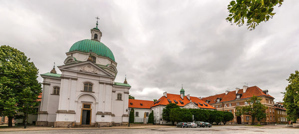 View of buildings against cloudy sky