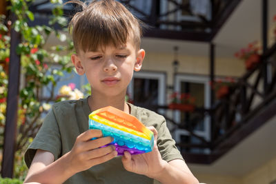 Portrait of boy holding ice cream