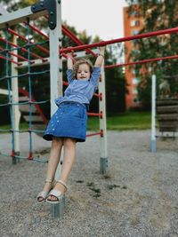 Full length of cute boy playing in playground