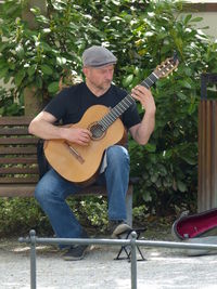 Full length of man playing guitar